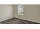 Bright carpeted bedroom with a window and neutral walls at 6026 Sally Ann Cir, Indianapolis, IN 46237