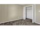 Neutral bedroom showcasing soft carpeting and an open, roomy closet at 6026 Sally Ann Cir, Indianapolis, IN 46237