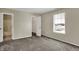 Neutral bedroom with plush carpeting, a window, and easy access to the closet and bathroom at 6026 Sally Ann Cir, Indianapolis, IN 46237