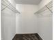 Walk-in closet featuring wire shelving and neutral carpeting at 6026 Sally Ann Cir, Indianapolis, IN 46237
