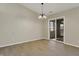 Bright dining room features wood-look flooring and sliding glass door access to the enclosed patio at 6026 Sally Ann Cir, Indianapolis, IN 46237