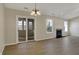Cozy dining area with wood-look flooring, adjacent to a sliding door and a view of fireplace at 6026 Sally Ann Cir, Indianapolis, IN 46237