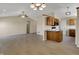 Inviting living room with a ceiling fan, a dining area, and light wood flooring at 6026 Sally Ann Cir, Indianapolis, IN 46237