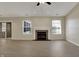Open living area with wood-look flooring, fireplace, and sliding doors to the exterior for bright living at 6026 Sally Ann Cir, Indianapolis, IN 46237