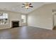 Bright living space with fireplace, wood-look flooring, and large windows, perfect for entertaining at 6026 Sally Ann Cir, Indianapolis, IN 46237