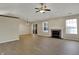 Inviting living room featuring a fireplace, wood-look flooring, and a large sliding glass door at 6026 Sally Ann Cir, Indianapolis, IN 46237