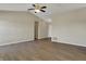 Spacious living area featuring vaulted ceiling, wood-look floors, and neutral walls, offering versatility at 6026 Sally Ann Cir, Indianapolis, IN 46237