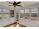 Bright sunroom with multiple windows, a ceiling fan, and lots of natural light at 6026 Sally Ann Cir, Indianapolis, IN 46237