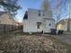 Backyard features a compact yard and convenient access to a rear entrance of the home at 614 E 5Th St, Anderson, IN 46012