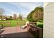 Back deck with chaise lounge overlooking a large green lawn and other houses at 6276 Quail Rdg W Dr, Plainfield, IN 46168