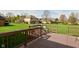 Back deck with chairs overlooking a large green lawn and other houses at 6276 Quail Rdg W Dr, Plainfield, IN 46168