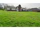 A large backyard with an even lawn offers ample space for recreation and gardening at 6276 Quail Rdg W Dr, Plainfield, IN 46168