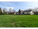 A well-maintained, expansive backyard offers plenty of room for outdoor activities and beautiful landscaping at 6276 Quail Rdg W Dr, Plainfield, IN 46168
