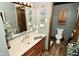 Bathroom featuring a wood vanity with mirror, and a toilet with storage at 6276 Quail Rdg W Dr, Plainfield, IN 46168
