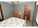 Bedroom featuring gray walls and a light-colored wood dresser at 6276 Quail Rdg W Dr, Plainfield, IN 46168