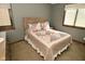 Bedroom with a decorative patchwork quilt and two windows providing natural light at 6276 Quail Rdg W Dr, Plainfield, IN 46168