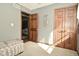 Bedroom featuring grey walls, wood doors, and carpet flooring at 6276 Quail Rdg W Dr, Plainfield, IN 46168
