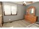 Bedroom featuring grey walls, a dresser with a mirror, and natural light at 6276 Quail Rdg W Dr, Plainfield, IN 46168