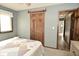 Bedroom with a decorative patchwork quilt, closet and grey walls at 6276 Quail Rdg W Dr, Plainfield, IN 46168