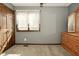 Bedroom featuring grey walls, a dresser with a mirror, and natural light at 6276 Quail Rdg W Dr, Plainfield, IN 46168