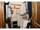 Walk-in closet with hanging clothes and shelves at 6276 Quail Rdg W Dr, Plainfield, IN 46168