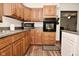 Kitchen with modern appliances including a microwave and oven at 6276 Quail Rdg W Dr, Plainfield, IN 46168
