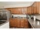 Well-lit kitchen with oak cabinets, modern appliances, and countertops at 6276 Quail Rdg W Dr, Plainfield, IN 46168