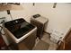 A laundry room showcasing Samsung washer and dryer appliances and ample space at 6276 Quail Rdg W Dr, Plainfield, IN 46168