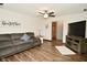 Inviting living room with a plush sofa, entertainment center, and neutral decor for a cozy atmosphere at 6276 Quail Rdg W Dr, Plainfield, IN 46168
