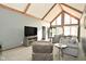 Spacious living room featuring vaulted ceilings, comfortable seating, and a entertainment center at 6276 Quail Rdg W Dr, Plainfield, IN 46168