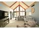 Open living area with vaulted ceilings, large windows, and comfortable seating offers a relaxing atmosphere at 6276 Quail Rdg W Dr, Plainfield, IN 46168