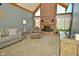 Bright living room boasts a cozy brick fireplace, vaulted ceilings, and comfortable seating at 6276 Quail Rdg W Dr, Plainfield, IN 46168
