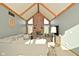Cozy living room features a brick fireplace, vaulted ceilings, and comfortable seating for a relaxing gathering space at 6276 Quail Rdg W Dr, Plainfield, IN 46168