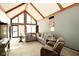 Spacious living room with vaulted ceilings, exposed beams, and ample natural light at 6276 Quail Rdg W Dr, Plainfield, IN 46168
