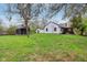 Extensive backyard showcasing a mix of sheds and the house exterior at 6481 Michigan Rd, Indianapolis, IN 46268