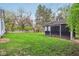 Spacious backyard with a shed and lush green lawn, perfect for outdoor activities at 6481 Michigan Rd, Indianapolis, IN 46268