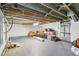 Unfinished basement area with bare ceiling and exposed ductwork, great for storage at 6481 Michigan Rd, Indianapolis, IN 46268