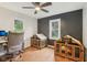 Bedroom with hardwood floors, two dog houses, and a nice view of the outside at 6481 Michigan Rd, Indianapolis, IN 46268