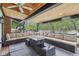 Inviting covered patio with comfortable seating and a stylish fire pit, perfect for outdoor entertaining at 6481 Michigan Rd, Indianapolis, IN 46268