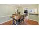 Charming dining room with a wooden table, and beadboard paneling at 6481 Michigan Rd, Indianapolis, IN 46268