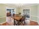 Dining room with wood table and chairs and access to the patio through sliding glass doors at 6481 Michigan Rd, Indianapolis, IN 46268