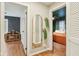 Hallway features hardwood floors and trim with views to bedroom and playroom spaces at 6481 Michigan Rd, Indianapolis, IN 46268