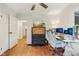 Office with hardwood floors, a light blue chair and desk, and plenty of sunlight at 6481 Michigan Rd, Indianapolis, IN 46268
