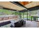Covered patio with ample seating, an outdoor fire pit, and a hot tub at 6481 Michigan Rd, Indianapolis, IN 46268