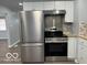 A well-equipped kitchen showcasing stainless steel appliances and modern cabinets, ready for your culinary adventures at 6642 E 47Th St, Indianapolis, IN 46226