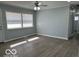 A bright, open living room with hardwood floors, offering plenty of space and natural light at 6642 E 47Th St, Indianapolis, IN 46226