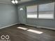 A bright living room with two large windows, filling the space with natural light and a welcoming atmosphere at 6642 E 47Th St, Indianapolis, IN 46226