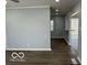 A view of the living room, offering sleek hardwood floors and a seamless transition to other spaces in the home at 6642 E 47Th St, Indianapolis, IN 46226
