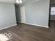 A well-lit living room with hardwood floors and neutral walls, ready for comfortable living and entertaining at 6642 E 47Th St, Indianapolis, IN 46226