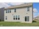Back of house with a sliding glass door and view of the green yard at 6681 Keepsake Dr, Whitestown, IN 46075